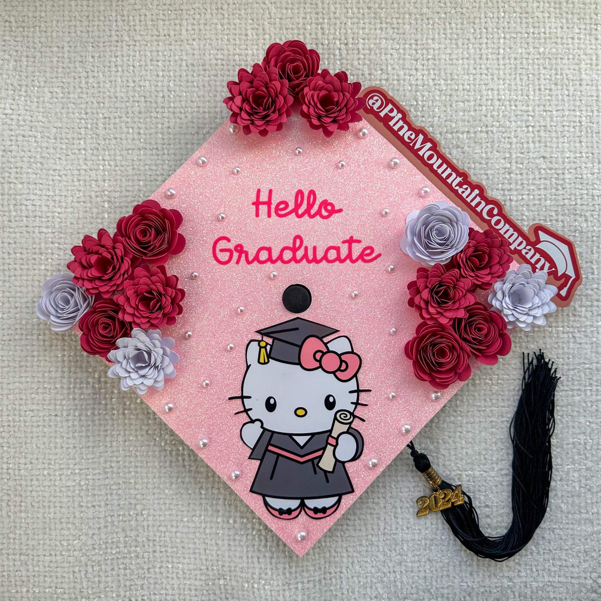 Hello Graduate" Hot Pink Floral - Hello Kitty Themed Graduation Cap T Pine Mountain Company Hello Graduate" Hot Pink Floral - Hello Kitty Themed Graduation Cap T Pine Mountain Company